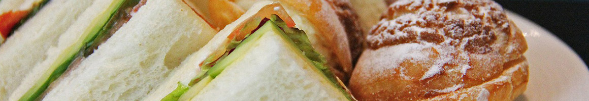 Eating Sandwich at Domini Sandwiches, restaurant in Spokane, WA.
